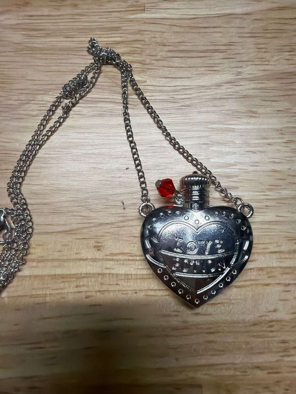 Heart-Shaped Silver Tone Love Potion Necklace with Red Accent